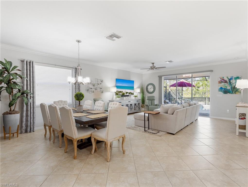 21116 Bella Terra Boulevard Estero, FL 33928 - Photo 5 of 49 a living room with fireplace furniture and a potted plant