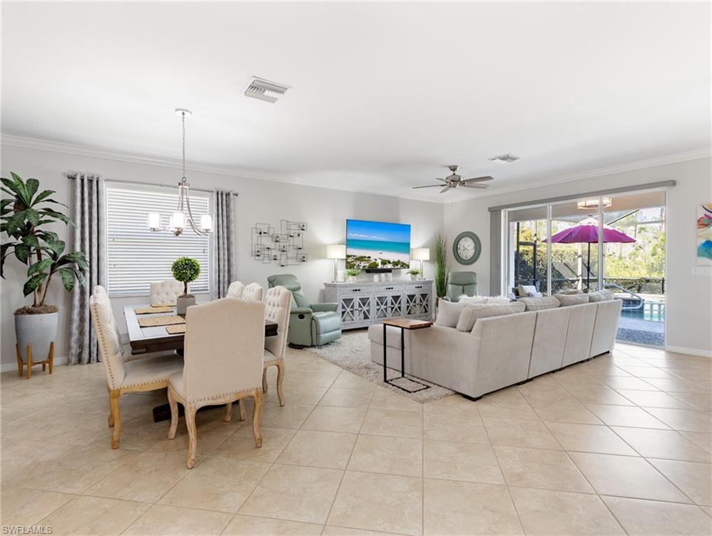 21116 Bella Terra Boulevard Estero, FL 33928 - Photo 7 of 49 a living room with furniture and a flat screen tv