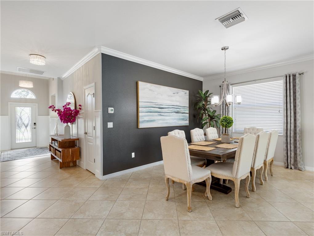 21116 Bella Terra Boulevard Estero, FL 33928 - Photo 8 of 49 a dining room with furniture and window