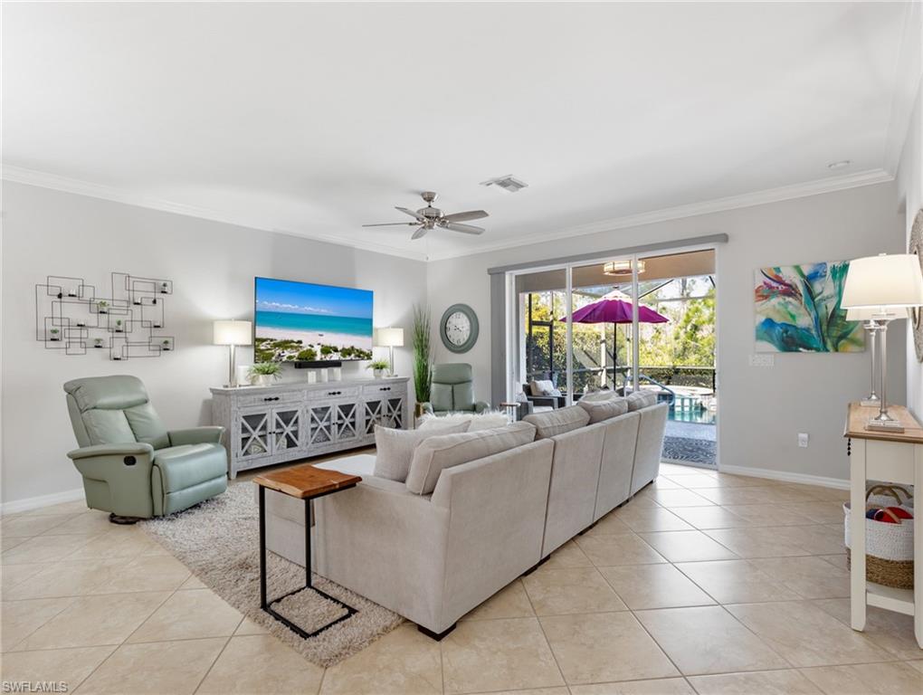 21116 Bella Terra Boulevard Estero, FL 33928 - Photo 9 of 49 a living room with furniture and a chandelier