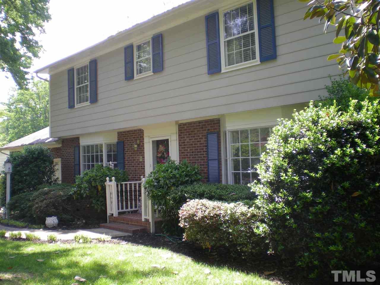 1308 Knights Way Raleigh, NC 27615 - Photo 2 of 25 a front view of a house with a yard