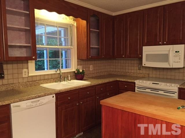 1308 Knights Way Raleigh, NC 27615 - Photo 16 of 25 a kitchen with a sink and cabinets
