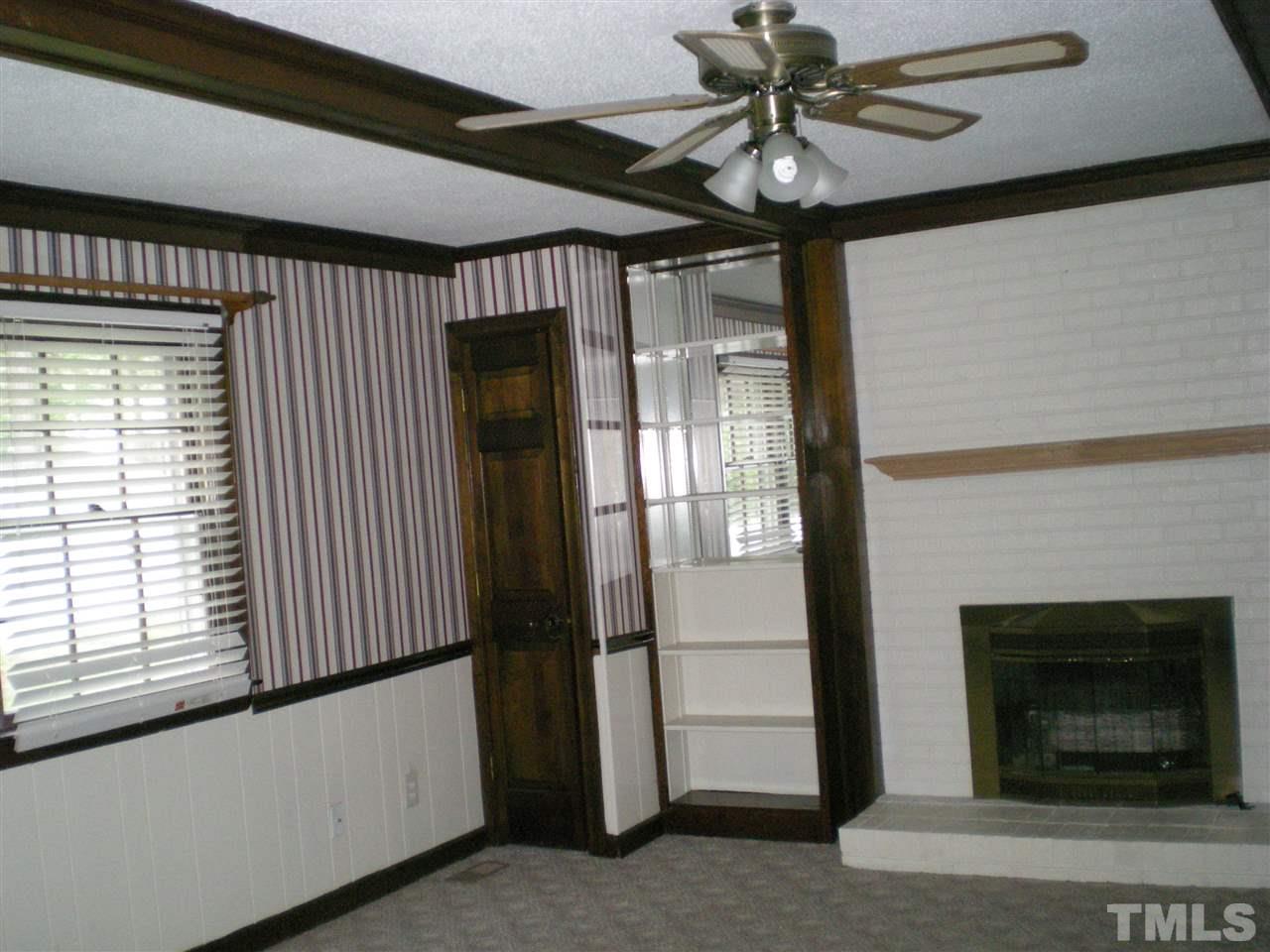 1308 Knights Way Raleigh, NC 27615 - Photo 18 of 25 a view of a livingroom with a ceiling fan and window