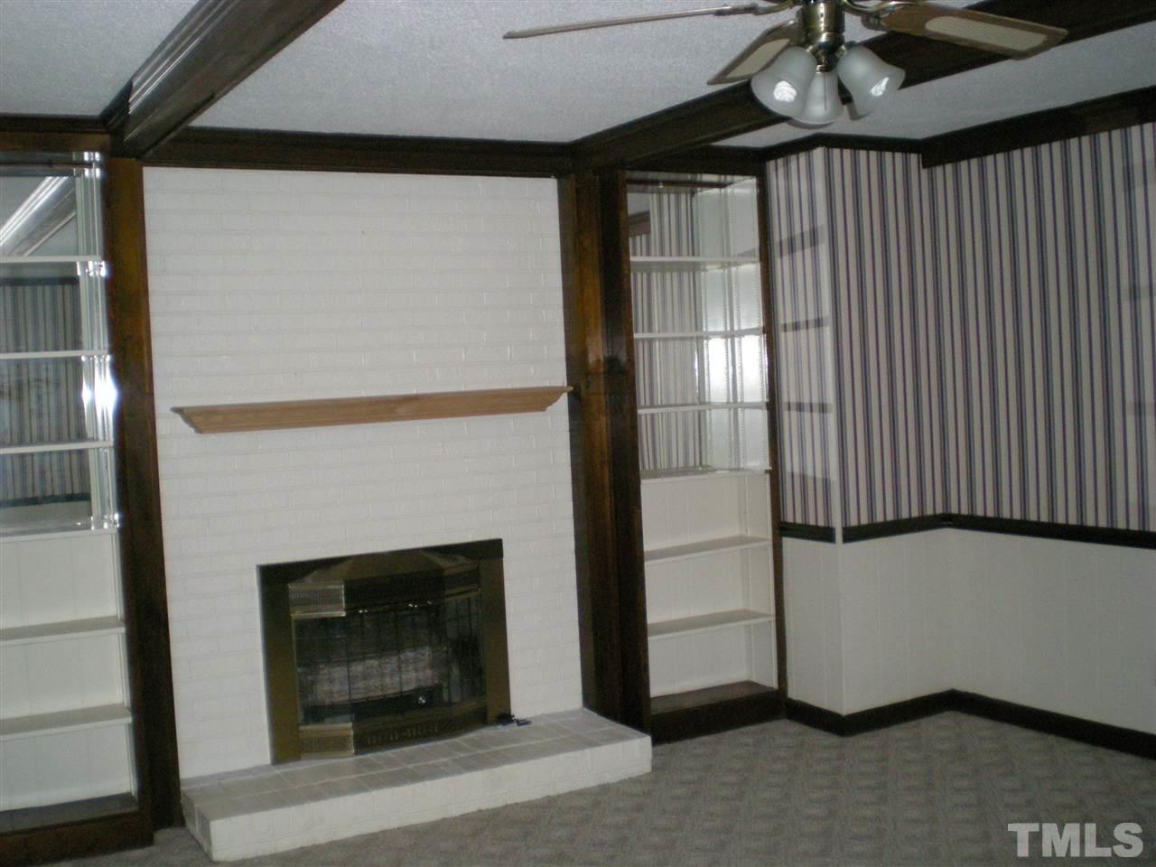 1308 Knights Way Raleigh, NC 27615 - Photo 19 of 25 a view of a livingroom with a fireplace