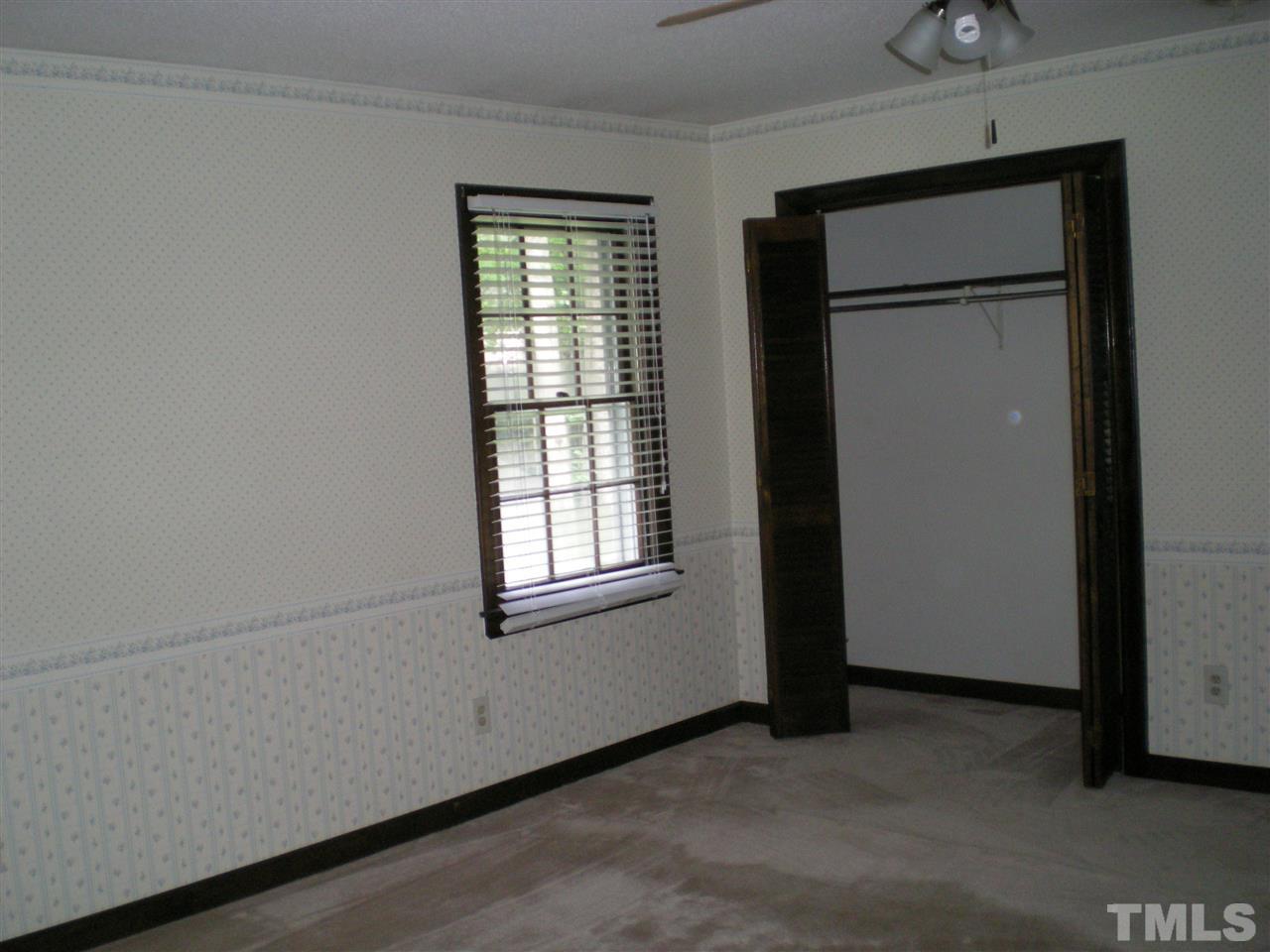 1308 Knights Way Raleigh, NC 27615 - Photo 22 of 25 an empty room with windows