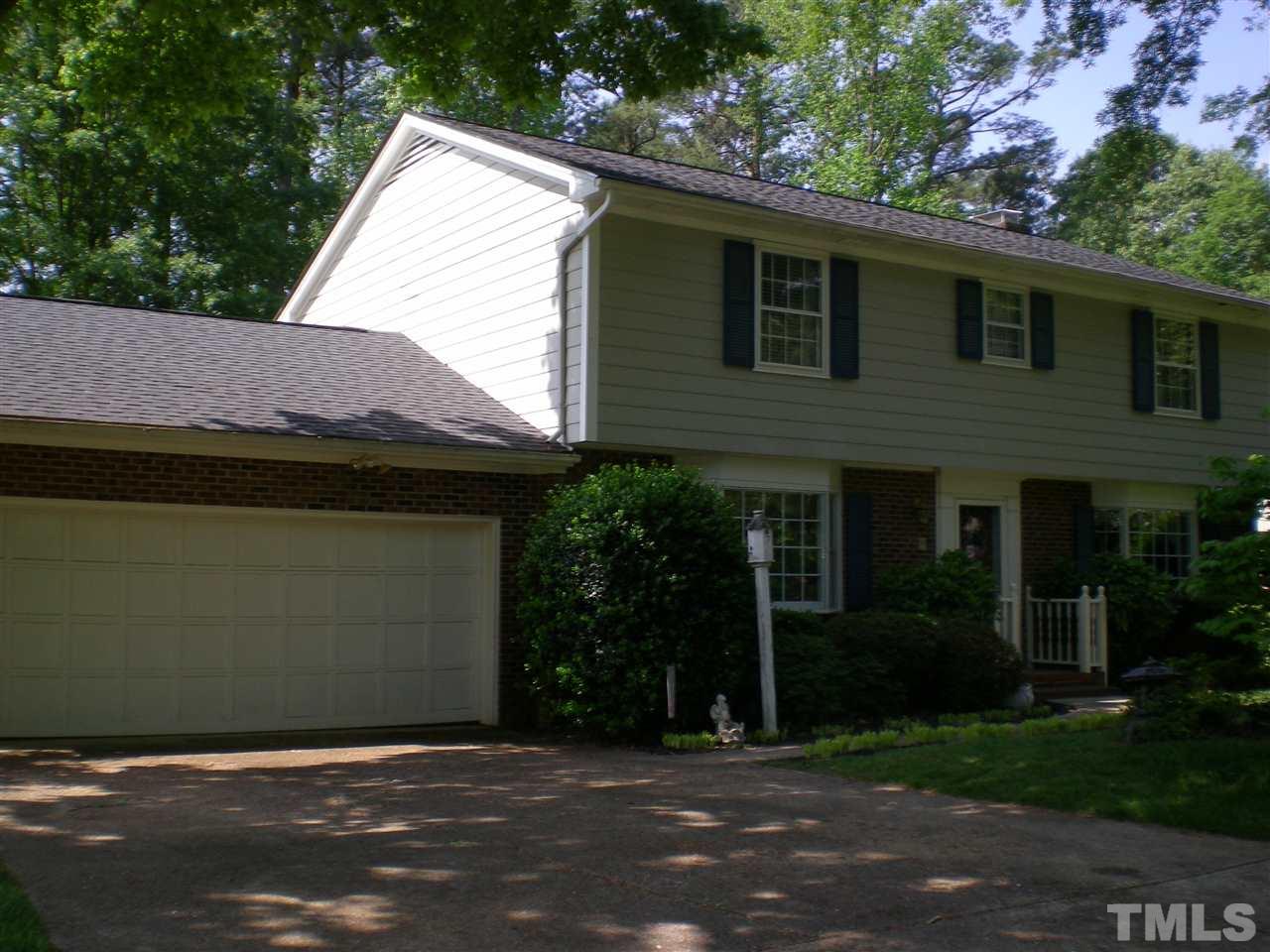 1308 Knights Way Raleigh, NC 27615 - Photo 4 of 25 a backyard of a house with plants and trees