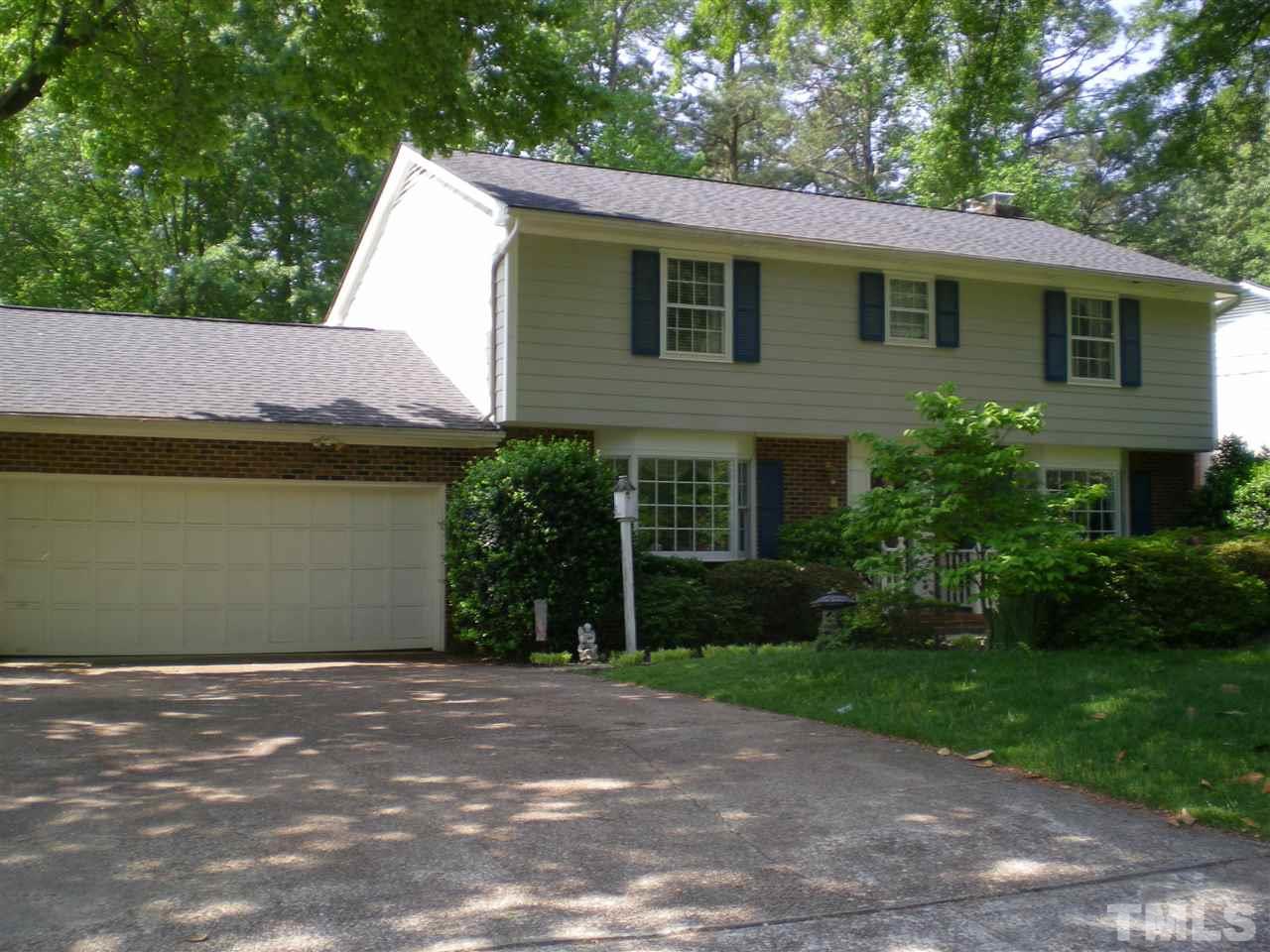 1308 Knights Way Raleigh, NC 27615 - Photo 5 of 25 a front view of a house with a yard