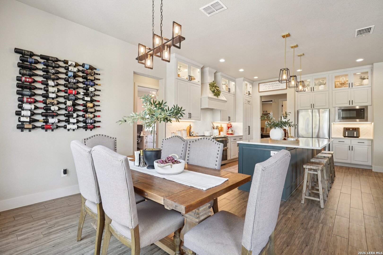 234 Sabella Spring Branch, TX 78070 - Photo 12 of 39 a dining room with furniture a chandelier and wooden floor