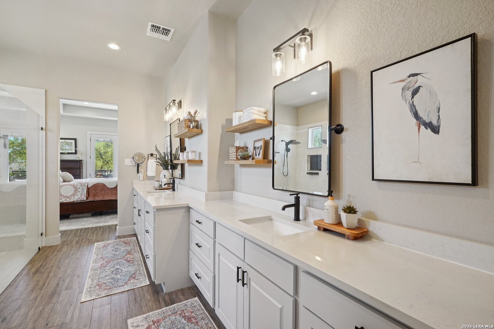 234 Sabella Spring Branch, TX 78070 - Photo 17 of 39 a spacious en suite bathroom with a double vanity sink and a mirror