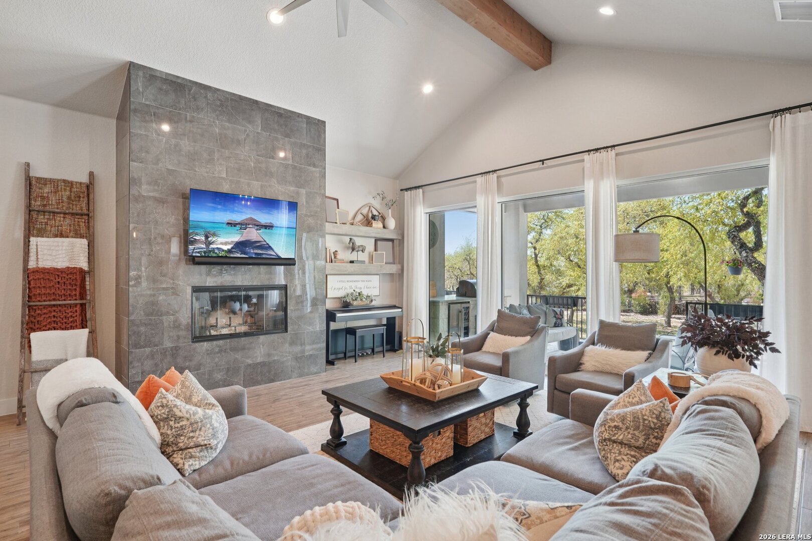 234 Sabella Spring Branch, TX 78070 - Photo 4 of 39 a living room with furniture ceiling fan and a floor to ceiling window