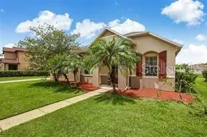 a view of a house with a backyard