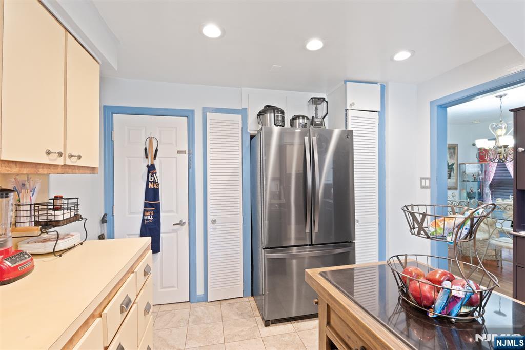 276 East 26th Street Paterson, NJ 07514 - Photo 12 of 30 a kitchen with stainless steel appliances kitchen island granite countertop a refrigerator and a stove