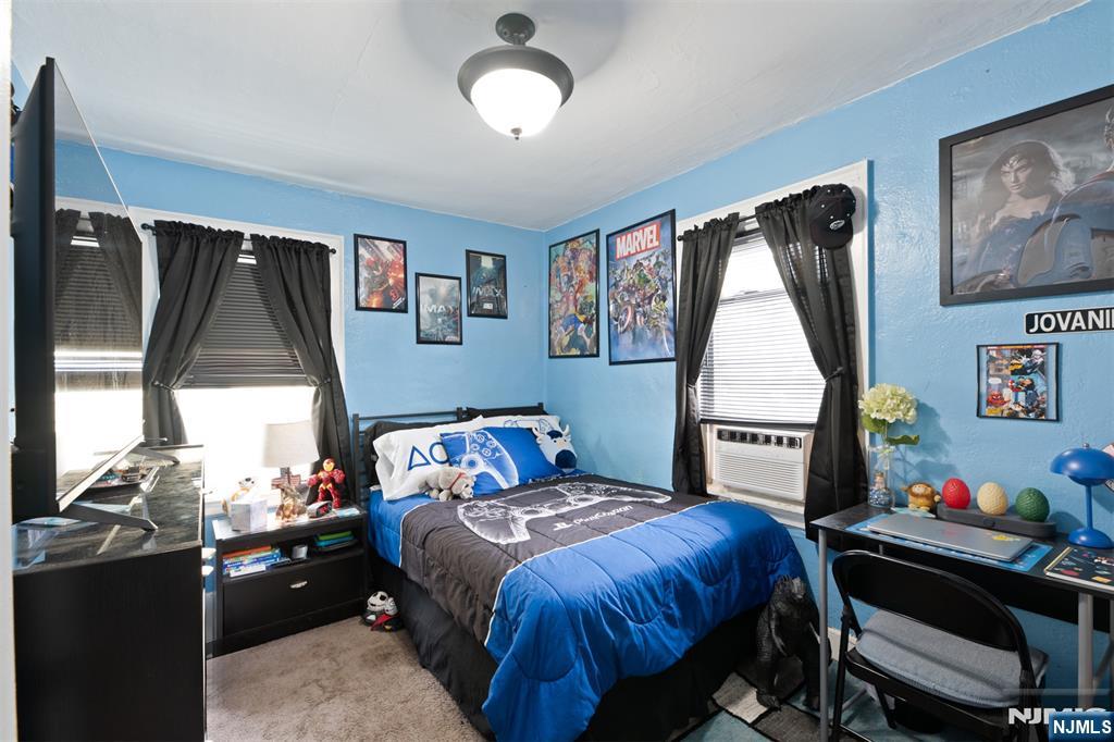 276 East 26th Street Paterson, NJ 07514 - Photo 18 of 30 a bedroom with a bed and a window