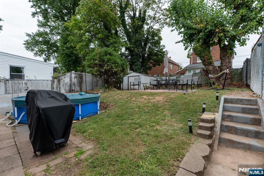 276 East 26th Street Paterson, NJ 07514 - Photo 23 of 30 a view of a house with backyard porch and sitting area