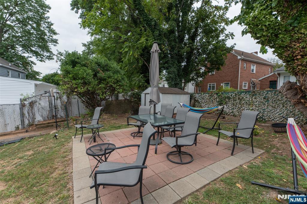 276 East 26th Street Paterson, NJ 07514 - Photo 25 of 30 a view of a backyard with sitting area and furniture