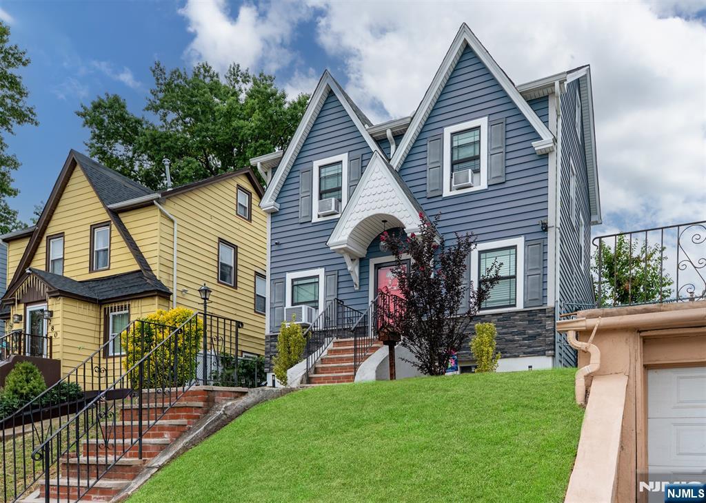 276 East 26th Street Paterson, NJ 07514 - Photo 30 of 30 a front view of a house with a garden