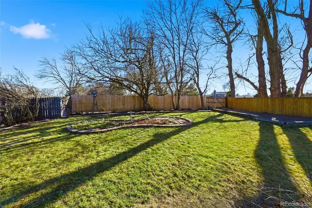 a swimming pool with outdoor seating and yard