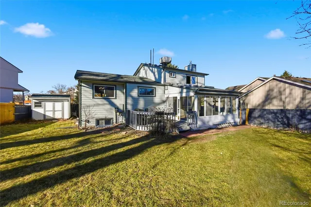 a view of a house with swimming pool and sitting area