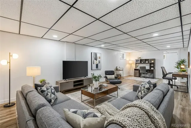 a view of a room with wooden floor