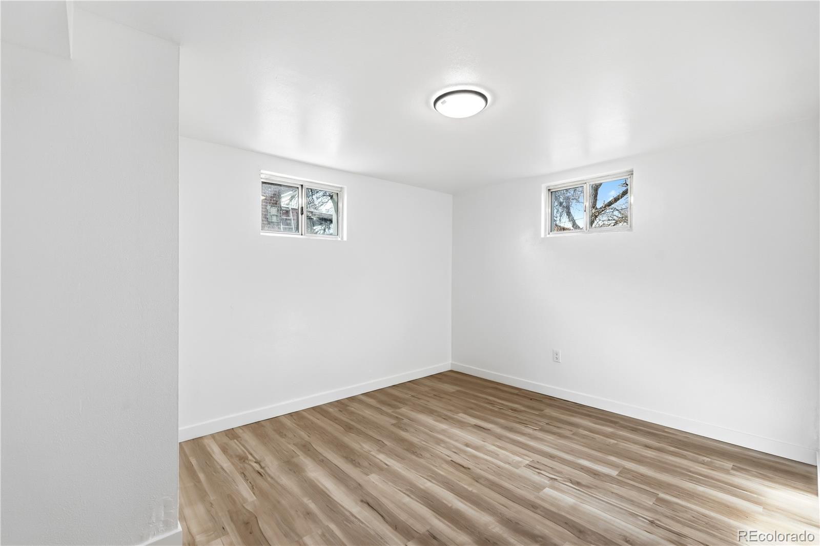 8331 Ogden Street Denver, CO 80229 - Photo 14 of 23 an empty room with a bench