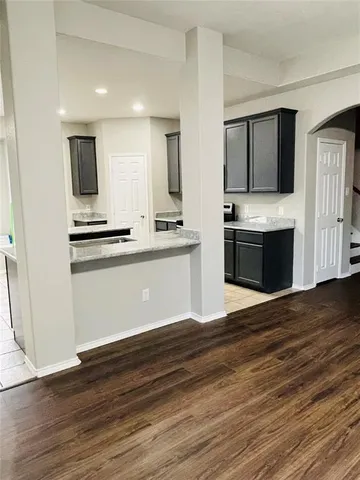 a kitchen with stainless steel appliances granite countertop a sink and stove top oven