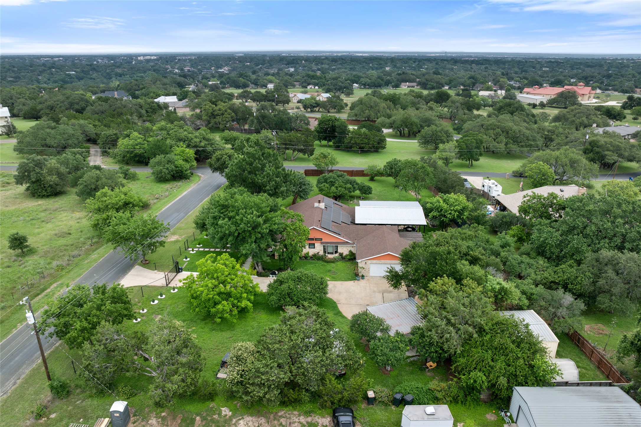 301 Oak Ridge Road Georgetown, TX 78628 - Photo 32 of 34 Expansive property featuring a single-story residence with an attached garage, a detached carport, and a separate storage structure