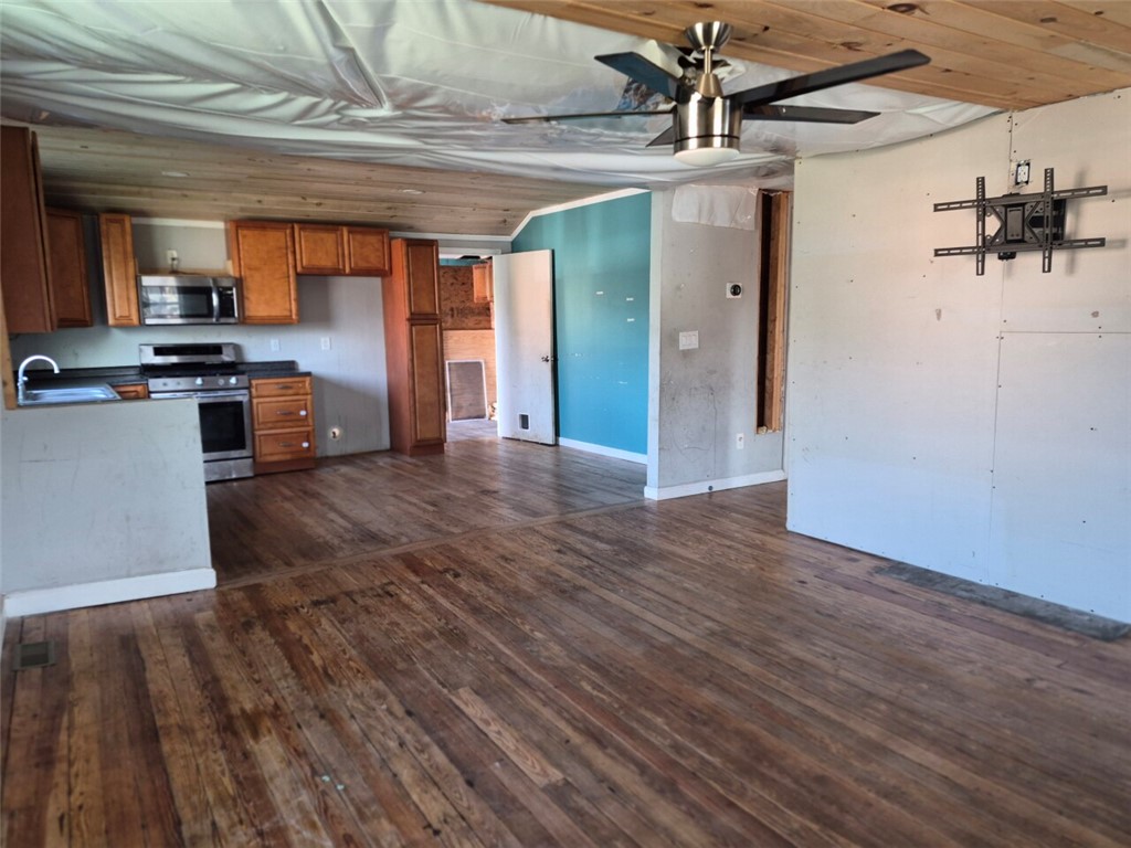 112 Overbrook Street Pickens, SC 29671 - Photo 3 of 19 This open-concept kitchen and living area feature warm wooden flooring, awaiting your personal touch.