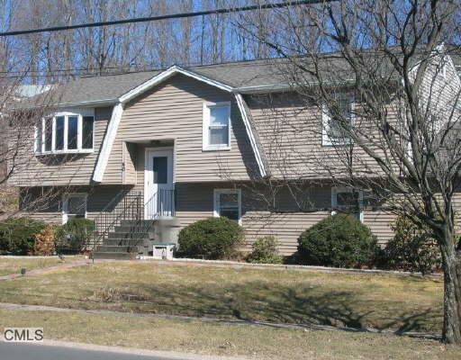 40 Plumtrees Road Bethel, CT 06801 - Photo 1 of 1 a front view of a house with a yard and garage
