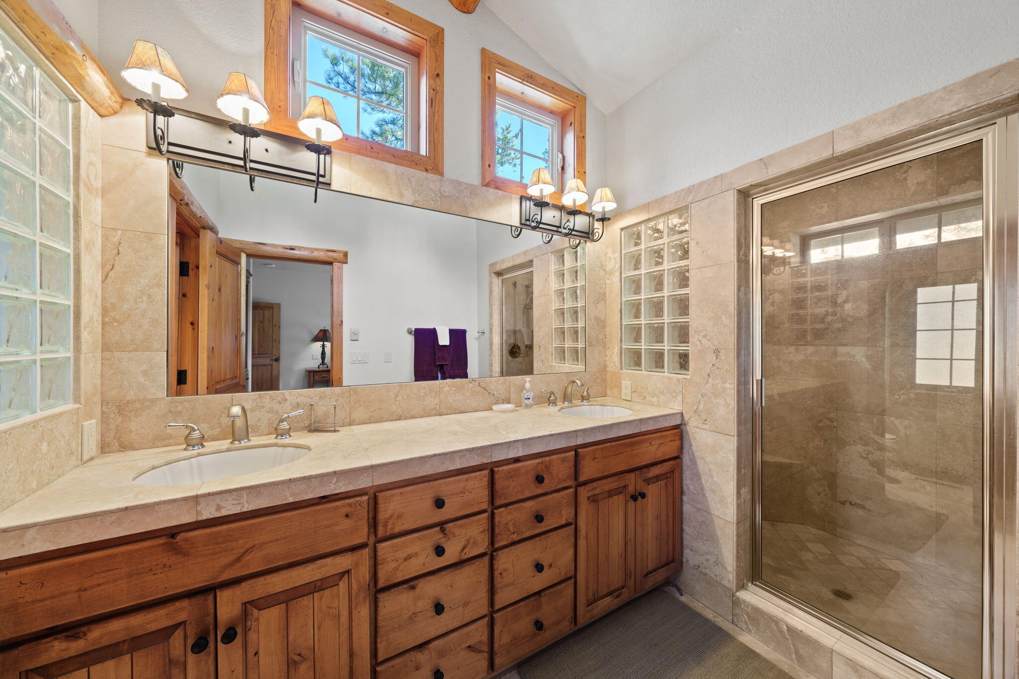 58026 Kinglet Road Sunriver, OR 97707 - Photo 20 of 39 a bathroom with a double vanity sink mirror and shower