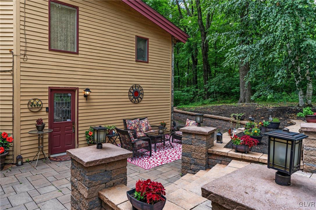 81 Palmer Road Bangor, PA 18013 - Photo 3 of 50 a view of a patio with open dining table and chairs and a barbeque