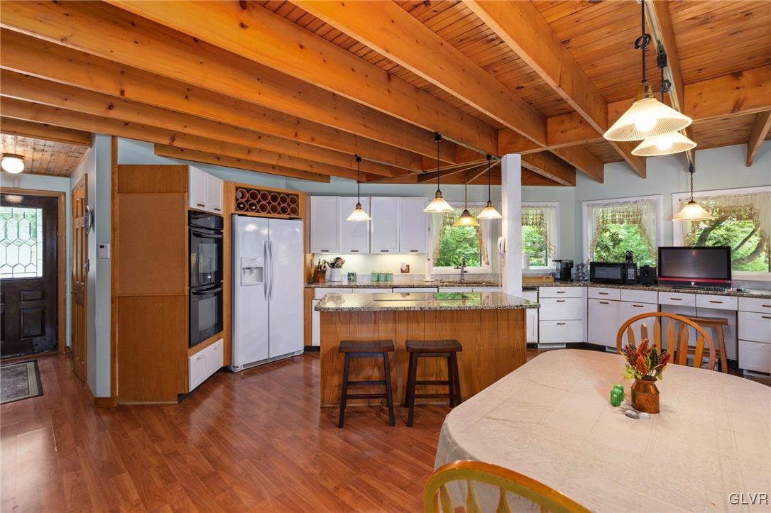 81 Palmer Road Bangor, PA 18013 - Photo 31 of 50 a kitchen with a table and chairs in it