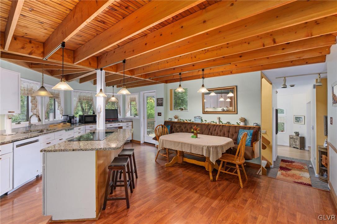 81 Palmer Road Bangor, PA 18013 - Photo 33 of 50 a dining room with wooden floors a table and chairs