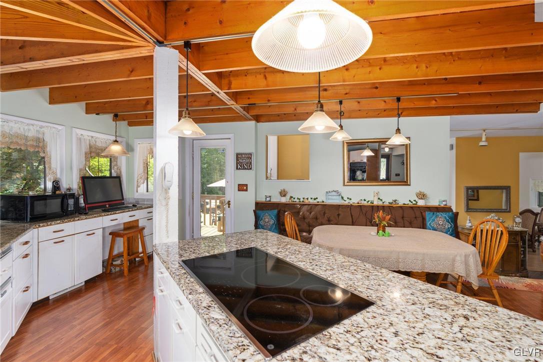81 Palmer Road Bangor, PA 18013 - Photo 36 of 50 a large kitchen with a sink and living room view