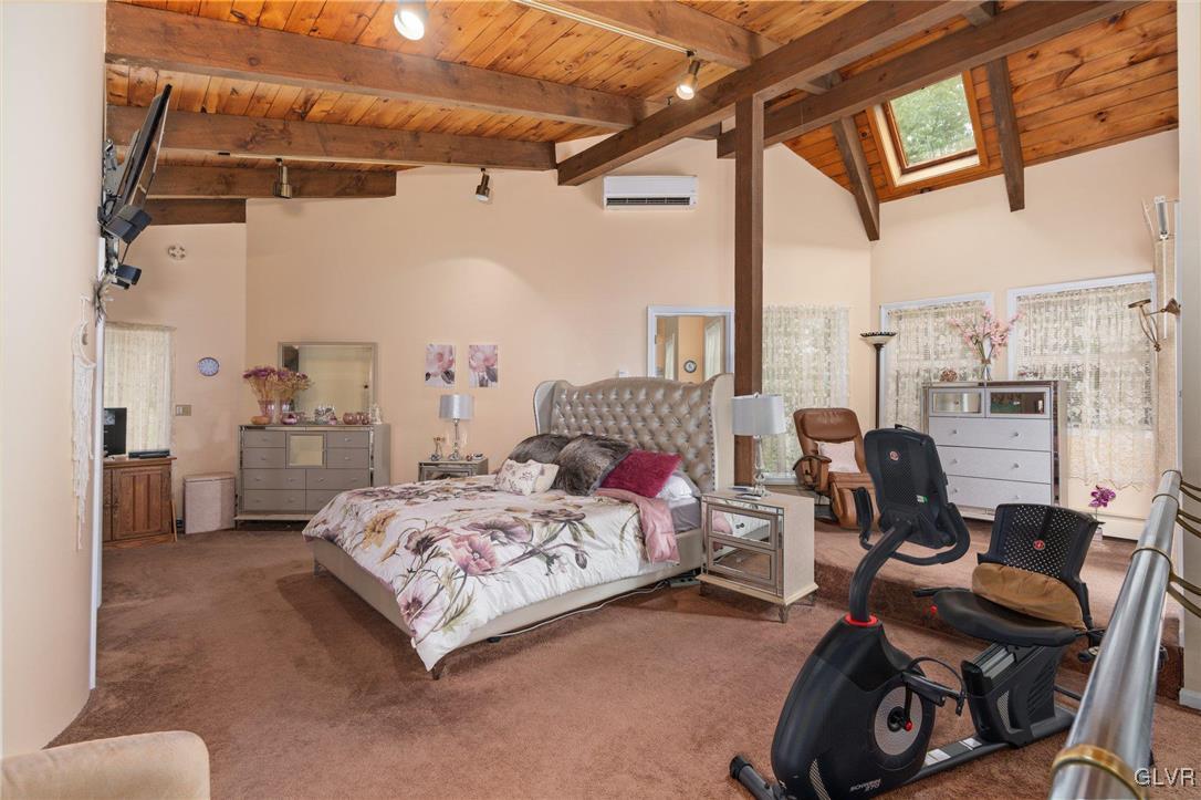 81 Palmer Road Bangor, PA 18013 - Photo 38 of 50 a bedroom with furniture a bed and a chandelier