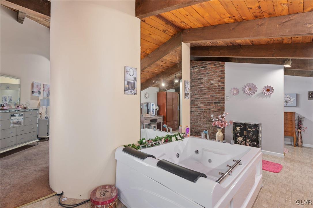 81 Palmer Road Bangor, PA 18013 - Photo 43 of 50 a bathroom with a tub sink and a mirror