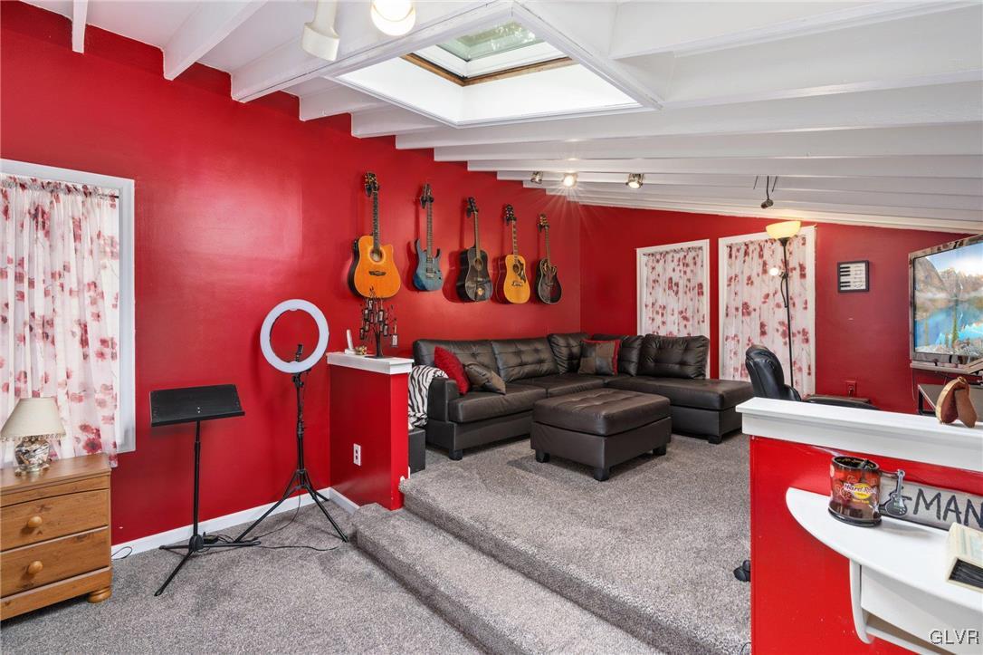 81 Palmer Road Bangor, PA 18013 - Photo 48 of 50 a living room with furniture gym equipment and large window