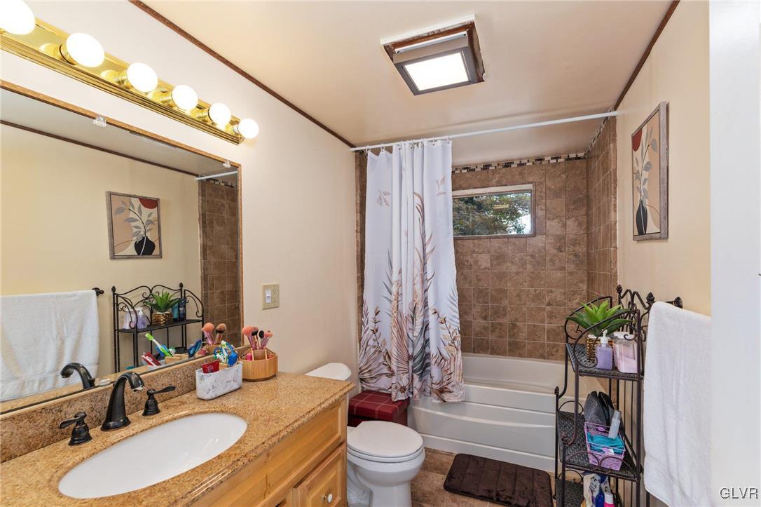 81 Palmer Road Bangor, PA 18013 - Photo 49 of 50 a bathroom with a sink toilet and shower