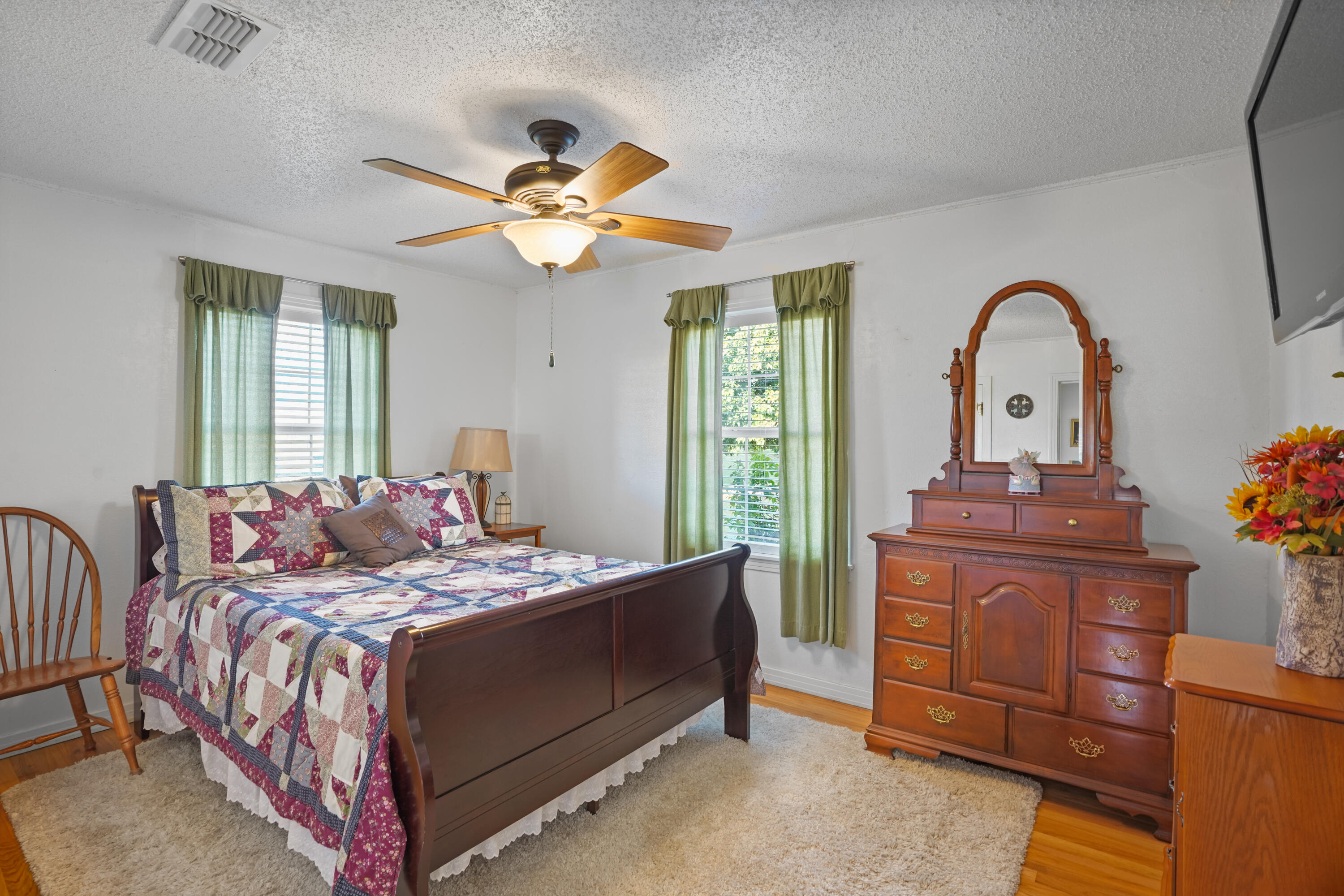 1501 County Road 216 Afton, TX 79220 - Photo 29 of 47 a bedroom with a bed and a chandelier
