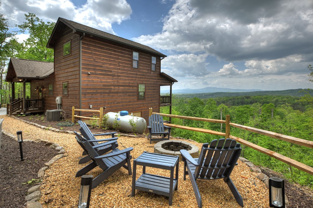 291 Tower Road Mineral Bluff, GA 30559 - Photo 18 of 55 a balcony with table and chairs