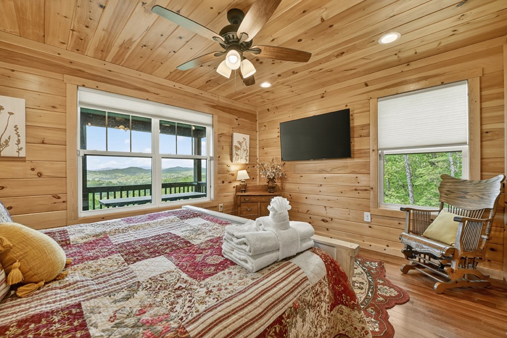 291 Tower Road Mineral Bluff, GA 30559 - Photo 34 of 55 a bedroom with a bed and glass window