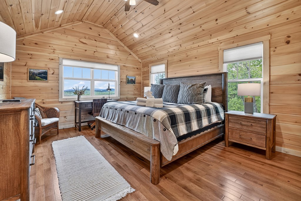 291 Tower Road Mineral Bluff, GA 30559 - Photo 39 of 55 a bedroom with a bed wooden floor and window