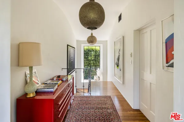 a living room with furniture a window and a table