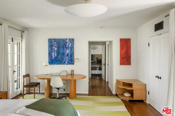 a bathroom with a sink and a large mirror