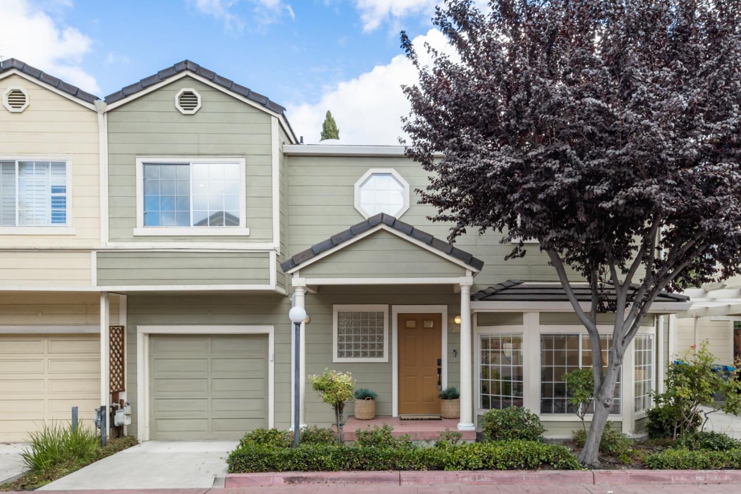 2064 Rialto Court Mountain View, CA 94043 - Photo 1 of 1 a front view of a house with a yard and garage