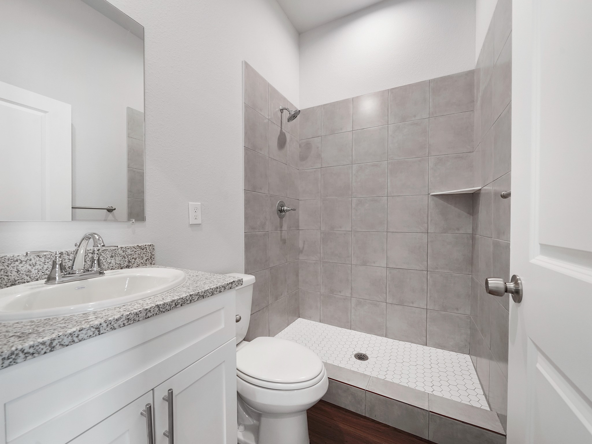 18846 Elegance Ave Spring Spring, TX 77379 - Photo 14 of 16 a bathroom with a granite countertop sink a toilet and shower