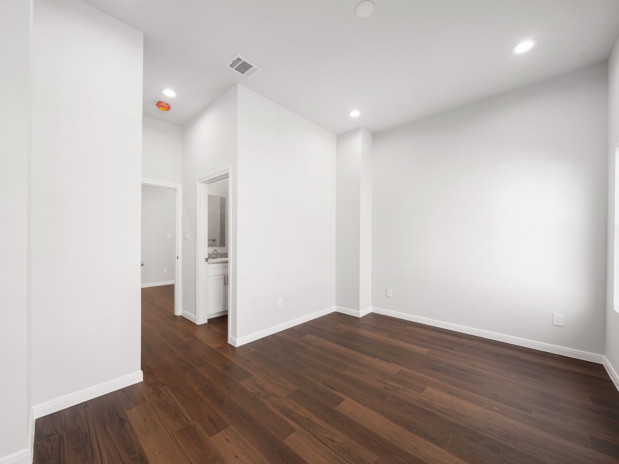 18846 Elegance Ave Spring Spring, TX 77379 - Photo 15 of 16 a view of an empty room with wooden floor