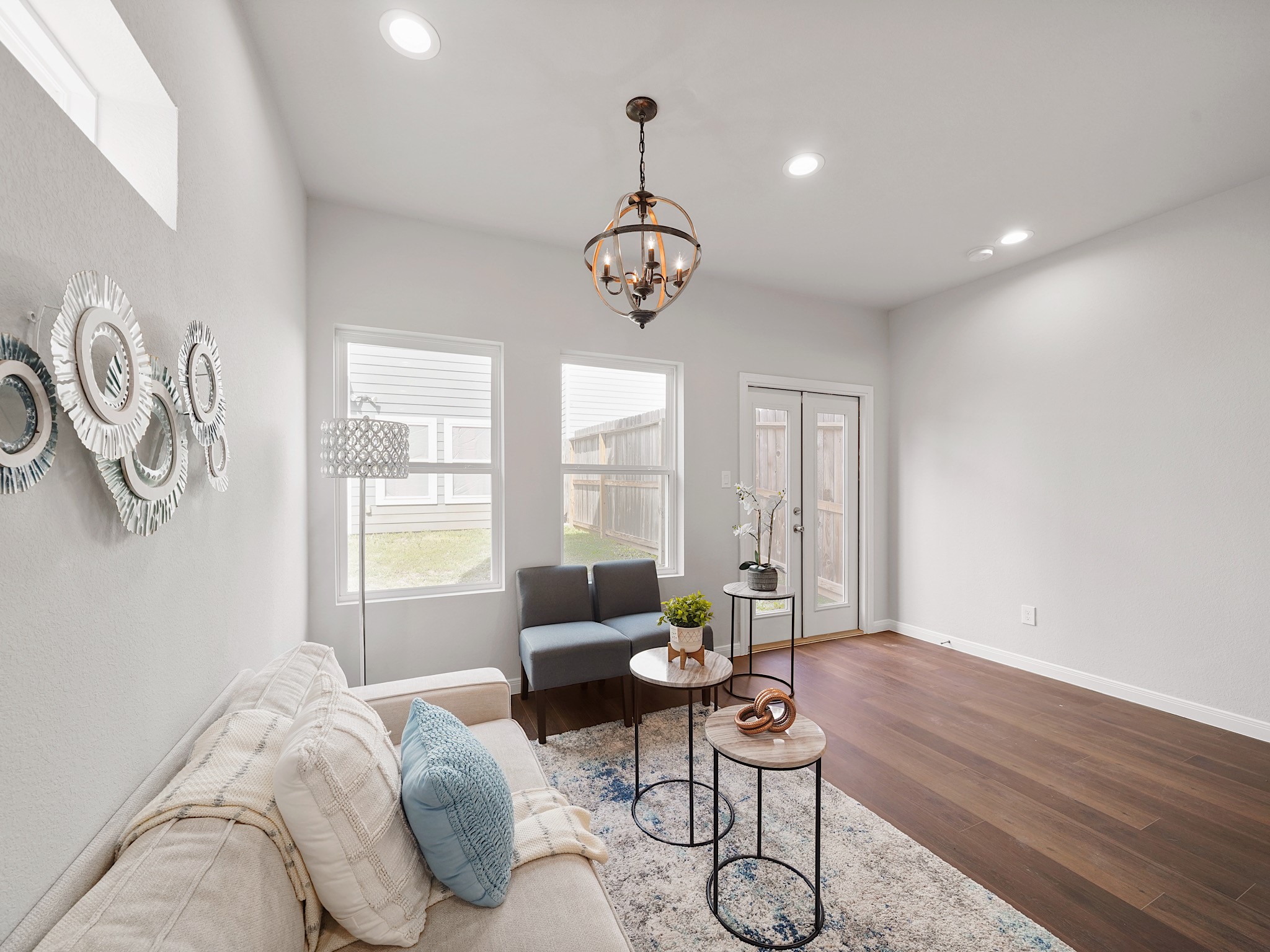 18846 Elegance Ave Spring Spring, TX 77379 - Photo 4 of 16 a living room with furniture chandelier and a window