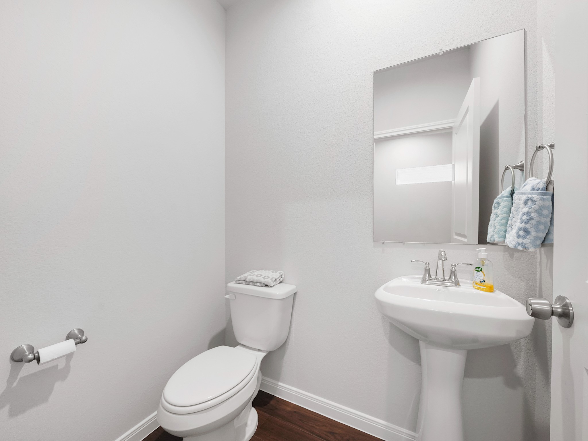 18846 Elegance Ave Spring Spring, TX 77379 - Photo 7 of 16 a white toilet sitting next to a bathroom sink