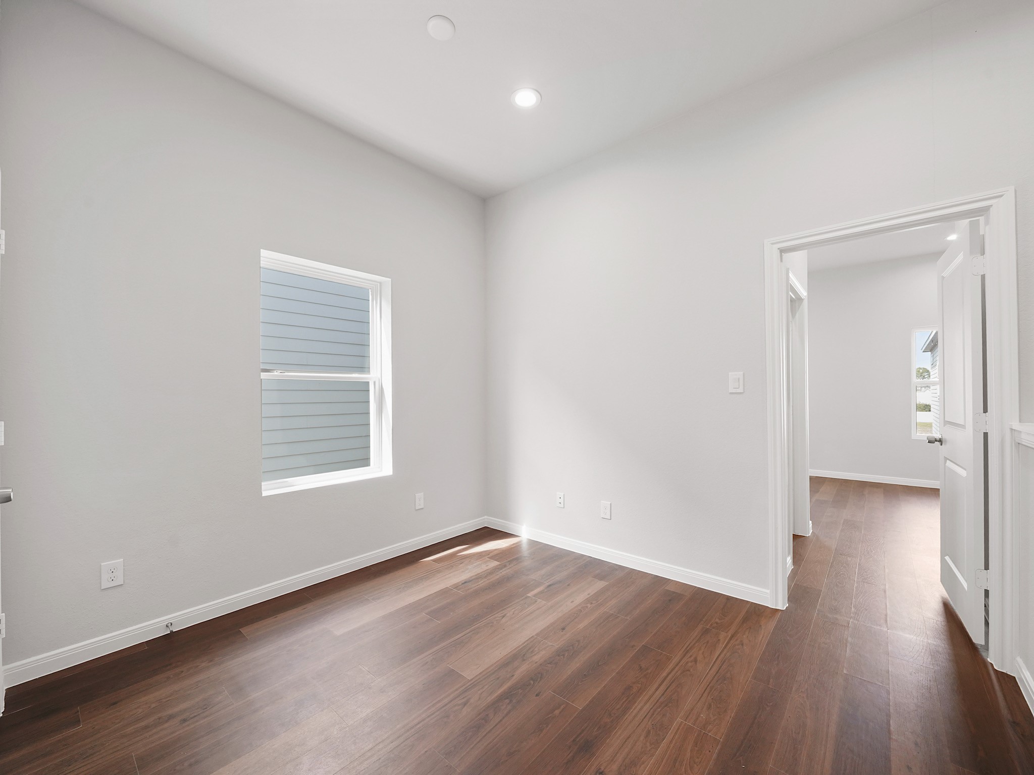 18846 Elegance Ave Spring Spring, TX 77379 - Photo 10 of 16 an empty room with wooden floor and a window