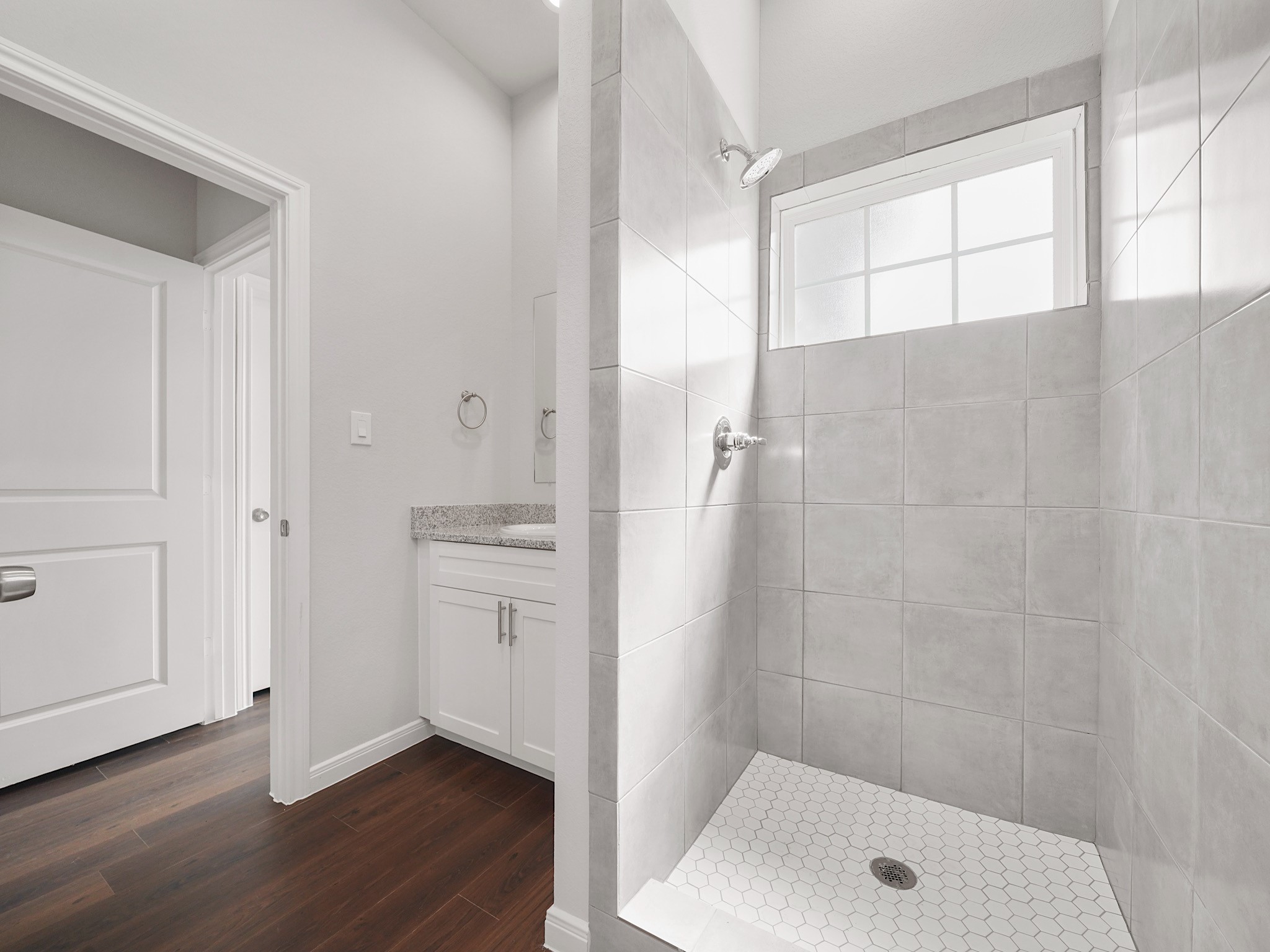 18846 Elegance Ave Spring Spring, TX 77379 - Photo 10 of 16 a bathroom with a shower and a sink